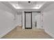 Bright main bedroom boasts an ensuite bathroom with a sliding barn door and tray ceiling at 2358 Tilson Rd, Decatur, GA 30032