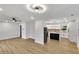 Open floor plan with bright living room flowing into a modern kitchen with an island at 2358 Tilson Rd, Decatur, GA 30032