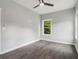 Inviting bedroom with a ceiling fan and plenty of natural light from the windows at 490 Third Ave, Scottdale, GA 30079