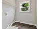 Laundry room with natural light and shelving at 490 Third Ave, Scottdale, GA 30079