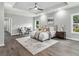 Spacious main bedroom with neutral tones and ample natural light, creating a relaxing retreat at 490 Third Ave, Scottdale, GA 30079