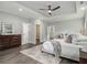 Spacious main bedroom with recessed ceiling, modern decor, and ample closet space at 490 Third Ave, Scottdale, GA 30079