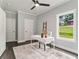 A stylish office space with natural light, featuring a white desk and neutral decor at 490 Third Ave, Scottdale, GA 30079