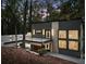 Modern home with gray metal siding and a concrete walkway leading to the front entrance at 1153 Dawn View Ne Ln, Atlanta, GA 30327