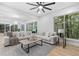 Bright living room features hardwood floors, a fireplace, and large windows with natural light at 1153 Dawn View Ne Ln, Atlanta, GA 30327