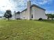 Spacious backyard with lush green lawn and neighboring homes, great for Gathering gatherings at 15 Emerson Trl, Covington, GA 30016