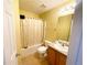 Neutral bathroom with a tub shower, beige tile floor, sink vanity, and decorative ceiling at 15 Emerson Trl, Covington, GA 30016