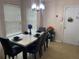 Modern dining room with a chic table set, stylish chairs, and bright natural light at 15 Emerson Trl, Covington, GA 30016