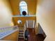 Spacious entryway featuring a large window, staircase, and hardwood flooring at 15 Emerson Trl, Covington, GA 30016