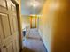Bright upstairs hallway with neutral walls and a carpeted floor at 15 Emerson Trl, Covington, GA 30016