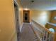 Hallway on upper level featuring bright walls, and a white stair railing at 15 Emerson Trl, Covington, GA 30016