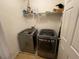 Laundry room featuring a new front load washer and dryer, plus a shelf at 15 Emerson Trl, Covington, GA 30016