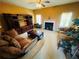 Comfortable living room with plush sofas, fireplace, and built-in shelves, perfect for relaxing at 15 Emerson Trl, Covington, GA 30016