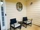 Cozy front patio with seating, perfect for enjoying a morning coffee or evening breeze at 15 Emerson Trl, Covington, GA 30016