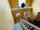 Well-lit foyer with staircase and landing area, featuring a large window at 15 Emerson Trl, Covington, GA 30016
