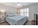 This primary bedroom features a ceiling fan, natural light, and carpeted floors at 1539 School House Run, Dacula, GA 30019