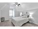 Vaulted ceilings, carpet floors, and natural light make this bedroom serene at 1539 School House Run, Dacula, GA 30019