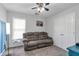 This bedroom features a couch, closet, ceiling fan, and carpet floors at 1539 School House Run, Dacula, GA 30019