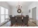 Dining room with wainscotting, chandelier and large table for hosting gatherings at 1539 School House Run, Dacula, GA 30019