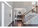 Elegant foyer with hardwood floors, staircase, and a view into the formal dining room at 1539 School House Run, Dacula, GA 30019