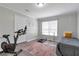 Home gym features modern exercise equipment and natural light from a bright window at 1539 School House Run, Dacula, GA 30019