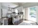 Bright kitchen with modern appliances, island seating, and a sliding glass door to the patio at 1539 School House Run, Dacula, GA 30019