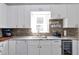 Charming kitchen showcases under-cabinet lighting and ample cabinet space at 1539 School House Run, Dacula, GA 30019