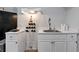 Cozy kitchenette with stainless steel appliances and custom cabinets at 1539 School House Run, Dacula, GA 30019
