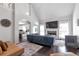 Open concept living room featuring high ceilings, a fireplace, and dark hardwood flooring at 1539 School House Run, Dacula, GA 30019