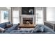 Cozy living room with a fireplace, plush seating, and natural light at 1539 School House Run, Dacula, GA 30019
