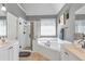 Bathroom with a soaking tub, tile floors, and a tiled glass shower at 1539 School House Run, Dacula, GA 30019