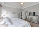 Bright bedroom with plush carpet, decorative ceiling and modern dresser at 1539 School House Run, Dacula, GA 30019