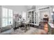 Bright office with built-in bookshelves, desk, chair, and view to dining room at 1539 School House Run, Dacula, GA 30019