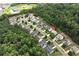 Breathtaking aerial perspective reveals the home's serene setting near a vibrant green space at 1530 Parkside Village Dr, Cumming, GA 30040
