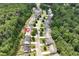 A picturesque aerial view of a lovely home nestled in a lush, green neighborhood at 1530 Parkside Village Dr, Cumming, GA 30040