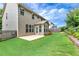 Spacious backyard with a well-manicured lawn and patio at 1530 Parkside Village Dr, Cumming, GA 30040