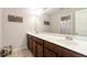 Bathroom featuring a double vanity and large mirror at 1530 Parkside Village Dr, Cumming, GA 30040