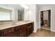 Well-appointed main bathroom features double sinks with granite countertops, soaking tub, and walk-in closet at 1530 Parkside Village Dr, Cumming, GA 30040
