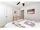 Comfortable bedroom features a ceiling fan, and double closets for ample storage at 1530 Parkside Village Dr, Cumming, GA 30040