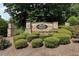 Stone community sign for Parkside Village with manicured bushes and landscaping at 1530 Parkside Village Dr, Cumming, GA 30040
