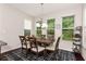 Charming dining area with large windows and elegant light fixture at 1530 Parkside Village Dr, Cumming, GA 30040