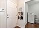 Inviting entryway features hardwood floors, a white front door, and a convenient coat rack for easy storage at 1530 Parkside Village Dr, Cumming, GA 30040