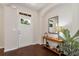 Bright foyer with hardwood floors, elegant decor, a front door with decorative glass, and a charming console table at 1530 Parkside Village Dr, Cumming, GA 30040