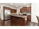 Modern kitchen featuring granite counters, stainless steel appliances, and island at 1530 Parkside Village Dr, Cumming, GA 30040