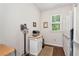 Functional laundry room with storage cabinets and natural light at 1530 Parkside Village Dr, Cumming, GA 30040