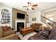 Cozy living room with fireplace, built-ins, and staircase access at 1530 Parkside Village Dr, Cumming, GA 30040
