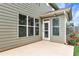 Back patio of home with view of a beautiful landscaped yard at 1530 Parkside Village Dr, Cumming, GA 30040