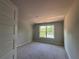 Bright bedroom features a window with natural light, carpet-ready floors, and smooth, paint-ready walls at 5381 Tuscany Dr, Douglasville, GA 30135