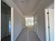 Bright hallway featuring white trim, fresh paint, and doors leading to various rooms at 5381 Tuscany Dr, Douglasville, GA 30135