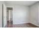 Bedroom with luxury vinyl plank flooring and a view into other rooms at 3604 Cameron Hills Pl, Ellenwood, GA 30294